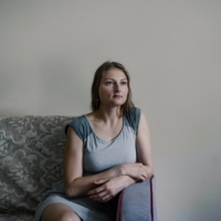 Evgenia Babayeva in her apartment in Vilnius, Lithuania, earlier this month. \"Arrests for what happened in 2020 are occurring practically every week, almost every day,” she said. | NANNA HEITMANN / THE NEW YORK TIMES
