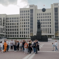 A tour group near the Lenin Monument in Minsk, Belarus, earlier this month.  | NANNA HEITMANN / THE NEW YORK TIMES