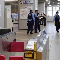 Police officers at Rinku Town Station in Izumisano, Osaka Prefecture, on Sunday | KYODO