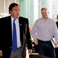 Going places: Google chief Eric Schmidt (second from right) and former New Mexico Gov. Bill Richardson leave a Beijing hotel Monday ahead of their visit to North Korea. | AP