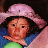 Impoverished: A young girl from the San Martin region of the Peruvian Sierra gazes into the camera in this photo taken in 1999. Mario Vargas Llosa says that in his childhood, Peru was poor and backward, but it had become \"poorer still and in many regions poverty-stricken, a country that was going back to inhuman patterns of existence.\" | KEVIN RAFFERTY