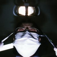 Open wide: A dentist looms over a patient. | KEVIN RAFFERTY PHOTOS