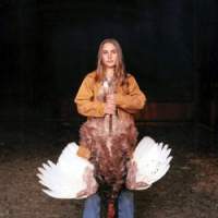 Laura Mcphee\'s \"Mattie with a Bourbon Red Turkey, Laverty Ranch, Custer County, Idaho, November\" (2004) | ALTURAS FOUNDATION &#169; LAURA MCPHEE