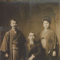 \"Mr. and Mrs. Umeya Shokichi and Sun Yat-sen\" (1914). Sun Yat-sen is shown seated. | COLLECTION OF AYANO KOSAKA