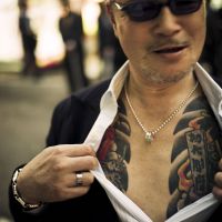 A yakuza street fighter shows off his tattoo. | &#169; ANTON KUSTERS, 2011