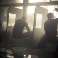 Scrub down: Members of the yakuza family shower in an onsen (Japanese bath house) after playing in a golf tournament. | &#169; ANTON KUSTERS, 2011