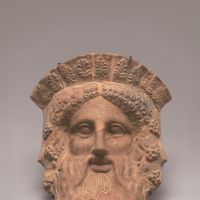 A clay \"Mask of Dionysos,\" Boeotia, (c. 450-400 BC), Paris, Musee du Louvre. CA 640 | &#169; DNP/ PHILIPPE FUZEAU