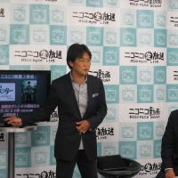 Picking up stream: Takeshi Natsuno (left), director at Dwango Co., presents Nico Nico Douga\'s new movie distribution service on Monday with  Taichi Fukuda, general manager of Warner Home Video and Warner Bros. Digital Distribution in Japan. | DWANGO CO.