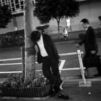 One for the road: The casualties of obligatory company drinking events are not an uncommon sight on the streets of major cities in Japan. But should konpa (parties) be banned? | AP