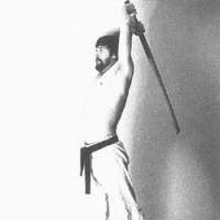 Young Nic wields a wooden sword, practices a karate strike, and other moves. | DRAWING (by MUNEHIRO IKEDA) and PHOTOS from \"MOVING ZEN\" by C.W. NICOL (Kodansha International; 2001)