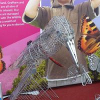 Making a point: One of many art works at BBWF, this kingfisher with a fish was made from dumped shopping carts recovered from waterways that are the bird\'s habitat. | MARK BRAZIL PHOTOS