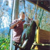 Doing as he says: C.W. Nicol butchers a deer shot by a hunter friend. | KENJI MINAMI