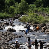 Formative and fun: These visiting schoolkids frolicking in the Torii River and getting in contact with the natural world are doing something that\'s off-limits to local youngsters. | C.W. NICOL PHOTOS