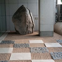 Form and textures: Parts of the garden feature patterns of stones and raked gravel, while geometric shapes draw the eye to a symbolic \"purity\" cone (below). | TOMOKO OTAKE PHOTO