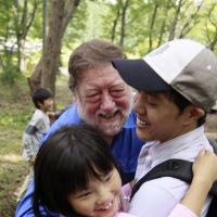 Natural healing: Our trust volunteers, myself and youngsters from tsunami-stricken Tohoku play in our woods in a program we run to help survivors recover. | YOUSUKE SUGA PHOTOS