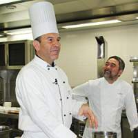 Executive Chef of the Greek Yacht Club, Konstantinos Vasalos (left) prepares the dough for his spanokopita dish while chef Kiyomi Mikuni watches on Bonding over Slow Food