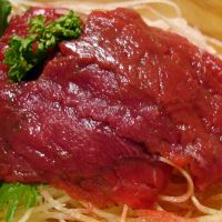 Some like it raw: Basashi (lean raw horse meat, above) is a popular side dish. Right: Sashimi-ready fish, known as saku, can be easily bought on the high street to prepare at home. | ROBBIE SWINNERTON
