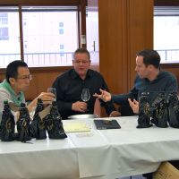 Nose for a winner (from left): International Wine Challenge sake division cochairs Kenichi Ohashi, Simon Hofstra and Sam Harrop participate in the tasting and evaluation of 689 sakes. The global contest was held last month; while it usually takes place in Britain, this year Japan hosted the sake assessment for the first time. | MELINDA JOE