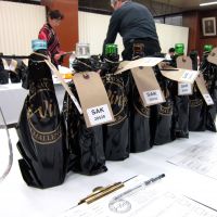 Love is blind: Bottles are concealed to ensure an unbiased tasting. Below: This year, 22 sake brands were awarded gold medals; the champion will be announced in September. | ROBBIE SWINNERTON