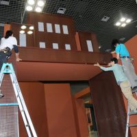Sweet job: Staff at “Chocolate: The Exhibition” finish building the entrance gate, made from real chocolate. Exhibition charts the rise of chocolate