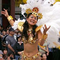 Foreigners are staying longer in Japan and contributing to the growing multiculturalism of the country, as seen in events such as the annual Asakusa carnival. | AP PHOTO