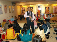 A Full-moon Hindu prayer meeting in a Yokohama hall (top); and Hari Hara Krishnan, his wife and daughter, at the Kasai Clean Town complex in Tokyo where some 200 Indian families live. Tokyo's Indians in 'home from home'