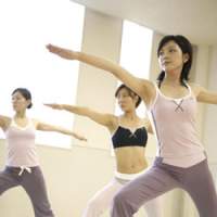Stretching and controlling their breathing in a sitting pose (top and above), models demonstrate yoga at a Tipness health club studio in central Tokyo, where yoga is one of the most popular lessons working women take before heading to the office. The lively early morning scene in the Marunouchi Cafe (below), one of the venues for \"Morning Expo\" held between May 21 and June 1, where yoga lessons and lectures on having proper breakfasts were held from 7.30 a.m. &#8212; and free coffee and rice balls were offered from 7 a.m. | PHOTOS COURTESY OF TIPNESS CO.; YUMI WIJERS-HASEGAWA PHOTO