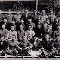 Young members of Aso Mining\'s large Korean forced labor workforce pose in front of the Yamato dorm at the Atago Mine in 1943. Most Korean labor conscripts were never properly paid. | PHOTO COURTESTY OF EIDAI HAYASHI