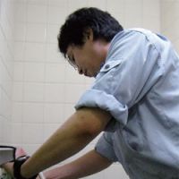 Finding shelter: A 34-year-old former \"Net-cafe refugee\" cleans an apartment room in Tokyo. | TOMOKO OTAKE PHOTO