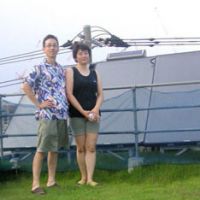 Home comforts: Keiko and Yoshiyuki Shimizu (above) stand by the solar-water heater on the rooftop garden of their home in Kawasaki, Kanagawa Prefecture (below). Although the couple say they are keen to live in an eco-friendly way, they also stress that they do not want to completely give up the benefits of modern life. | TOMOKO OTAKE; COURTESY OF YOSHIYUKI SHIMIZU