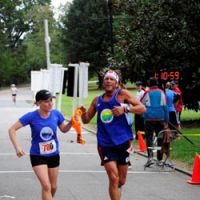 Taking over: A competitor in the 18th annual Atlanta Ekiden Relay held in the Georgia city on Sep. 21 passes her team\'s  tasuki  cord to the next runner as she reaches the end of her stage. The popular 30 km event, divided into 5 km legs, features 14 divisions and makes for a festive day in the city. | DUTCH WALTERS