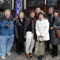 Group shot: Members of this year\'s Seven Lucky Gods Tour pose together in front of Seiunji temple in Nishi Nippori in Tokyo\'s Arakawa Ward. Miki Oyama, Woman\'s Group vice president is third from right in front, with Alan and Eugenia Josephine Mindlin on the far left. Naomi Horie is second from right and Meiko Ninomiya is on the far right. | YOSHIAKI MIURA PHOTO