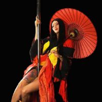Lu Nagata poses on the pole after a performance. | NOBUHIRO WADA PHOTO