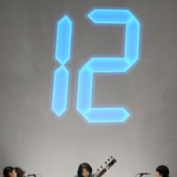 Catch the beat: Daikichi Yoshida plays the sitar at \"MAMC Night,\" a members\' event held Jan. 20 at the Mori Art Museum in Tokyo\'s Roppongi. Numbers projected on the wall help the audience learn the beat pattern for the clapping accompaniment. | YOSHIAKI MIURA PHOTOS