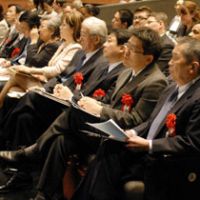 Judges with red roses on their lapels listen intently to the speeches. | MAMI MARUKO PHOTO