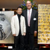 Art for food: Hitoshi Ohashi and Robert Tobin (left), organizers of the \"Silent Auction\" event, pose for a photo at the auction\'s venue, a restaurant in Tokyo\'s Shibuya Ward. | YOSHIAKI MIURA PHOTOS