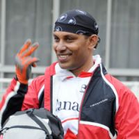 Pedal power: Don Kalubowila, founder of the charity Give a Dream a Chance, introduces himself and signs his name to children of Meisei Gakuen primary school, a school for the deaf, before he sets off on a charity ride to Hokkaido | SATOKO KAWASAKI PHOTOS