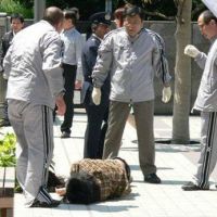 \"Outrageous\": Activists claim the photo above shows a student lying unconscious after being roughed up by security guards hired by Hosei University during a rally at its Ichigaya campus. | COURTESY OF ZENGAKUREN