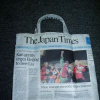 Topical tote: A sturdy shopper made in minutes from “waste” paper. Bags of fun recycling old JTs
