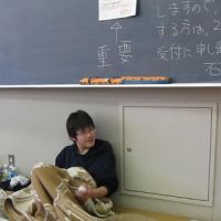 School\'s out: A refugee lives in a lecture room at Ishinomaki Senshu University, Miyagi Prefecture. The campus has been turned into a temporary crisis center. | COURTESY OF KIKOKUSHIJO ACADEMY