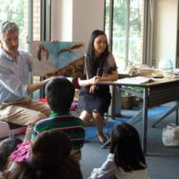 A picture is worth a thousand words: Nikolaos Zaimis, first counselor of the European Union\'s delegation to Japan, reads the Greek tale of \"Icarus\" in Greek in front of families during a book-reading event at the EU office in Chiyoda Ward, Tokyo, on Saturday. | MAMI MARUKO PHOTO