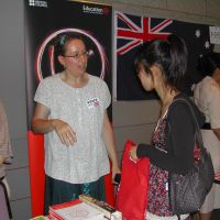 Educational options: Emma Parker, education project manager at the British Council, talks to a Japanese student taking part in an event July 26 at the Canadian Embassy in Tokyo to encourage Japanese to study abroad. | YOSHIAKI MIURA PHOTOS