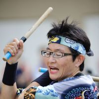 Tomoko Igarashi, who has been teaching taiko drumming for the last 14 years, poses with her students during a lesson held last month at the British School in Tokyo. | COURTESY OF MIYABI ARASHI TAIKO SCHOOL, GIANNI SIMONE