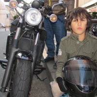 Their word against the law\'s: Jian Macdonald, now 9, poses on the bike that he and his father, Todd, allege was vandalized by a nightstick-wielding police officer during an argument outside the Marui department store in Senju, in Tokyo\'s Adachi Ward, on Oct. 29. Jian and Todd say the officer punched Jian in the shoulder and shook him violently when he tried to take a cellphone video of the altercation between his father and the officer, during which the bike\'s front fender was apparently broken. | SIMON SCOTT