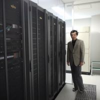 Electric dreams: University of Tokyo professor Hideaki Fujitani and the university\'s supercomputer, which is used just for the purpose of running simulations on potential drugs. | TOMOKO OTAKE
