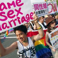 On again, off again: Gay and lesbian rights activists demonstrate at the Tokyo Pride Parade in August 2007 in Yoyogi Park. | AP