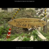 Timely advice: This message written on a surfboard was photographed by filmmaker Michael Arias in Tohoku following the March 11, 2011, tsunami that devastated parts of the region. The work was recently shown at a Japan film festival in Frankfurt, Germany. | MICHAEL ARIAS