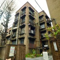 Fond farewell: The steel-and-concrete Uenoshita Apartments building in Tokyo\'s Ueno district (above) is the last of the Dojunkai complexes that were built in the aftermath of 1923\'s Great Kanto Earthquake. The few remaining occupants, including Helmut Rudolph, are gradually moving out as the apartments are sold to developers. When all are sold, the building will be demolished. | YOSHIAKI MIURA PHOTOS