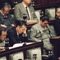 Snoozeville: Liberal Democratic Party lawmakers in the Lower House of the Diet pay little or no attention as Prime Minister Toshiki Kaifu, the leader of their party, addresses the opening session of the Diet in March 1990. | AP