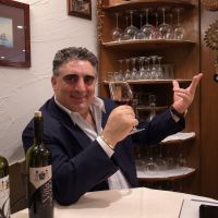 Grazie!: Elio Orsara samples a glass of new wine from his own vineyards at the dining room of his restaurant in Tokyo. In wake of 3/11 disasters, successful Italian helps those who helped him
